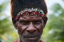 Asmat tribesman with traditional hat near Agats, West Papua