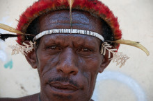 Dani man with traditional headdress