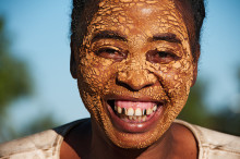 smiling woman with mud mask, Madagascar