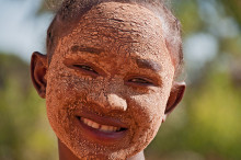 smiling girl with mud mask, Madagascar